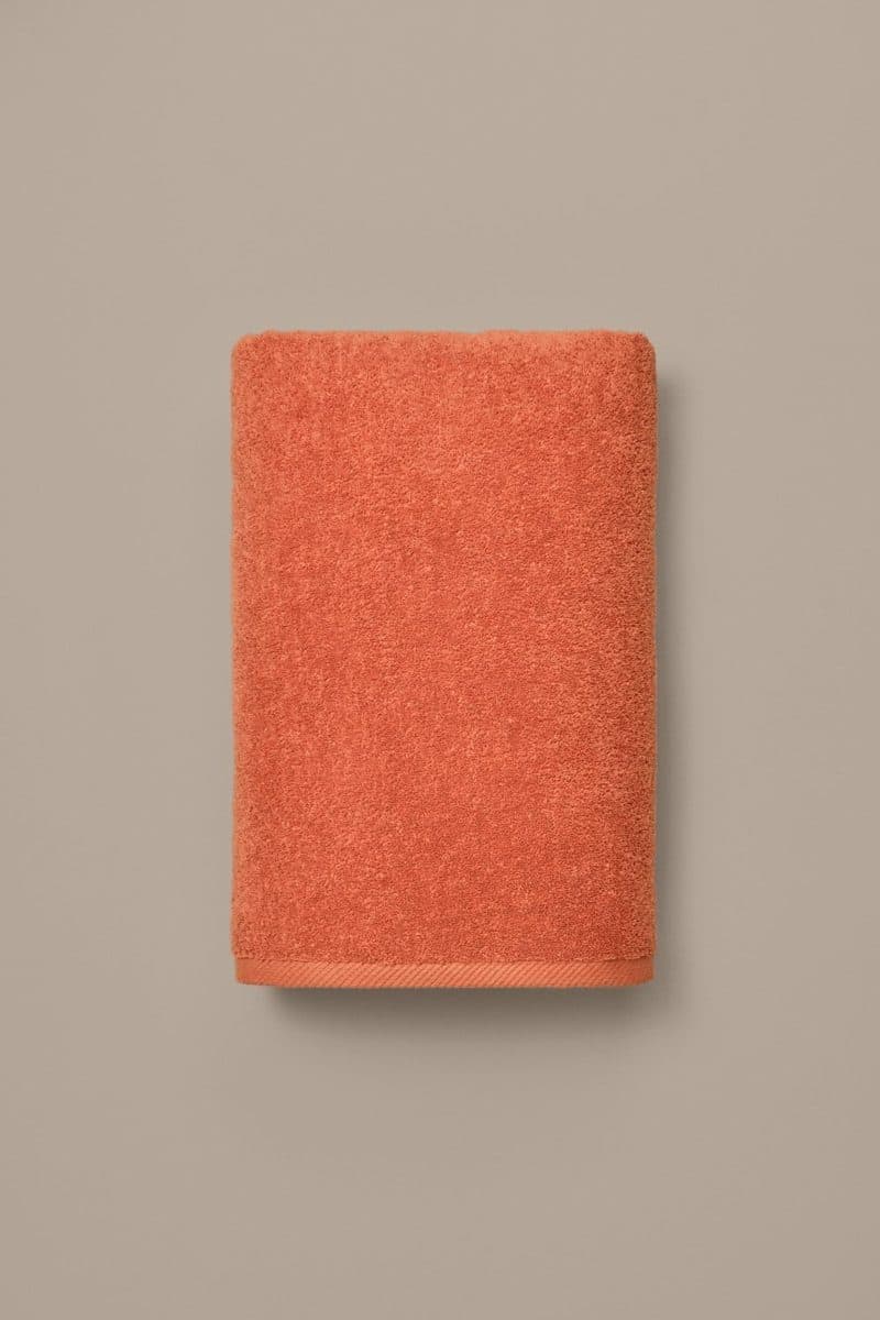 Poolhanddoek Mimosa vlak opgehangen, effen warm oranje